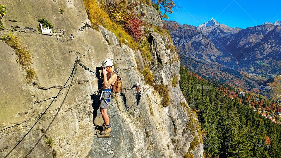 Two friends on vacations climbing in Switzerland