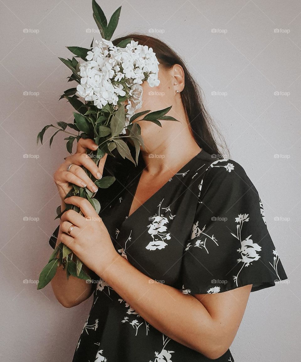 Photo of a girl with white flowers