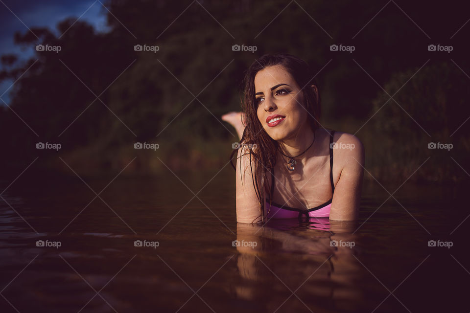 Beautiful woman enjoying in river