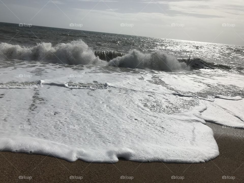 Loving this dramatic shot, where the sea looks to the first eye as if something has uprooted, during a large wave formation and has planted itself in the ocean.