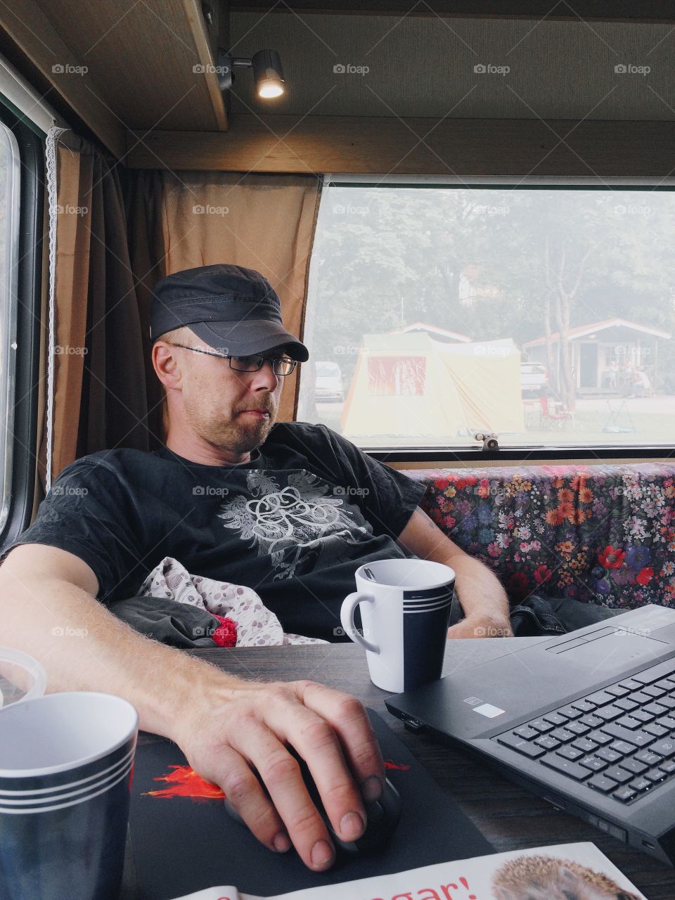 A moment. Man sitting in the caravan 