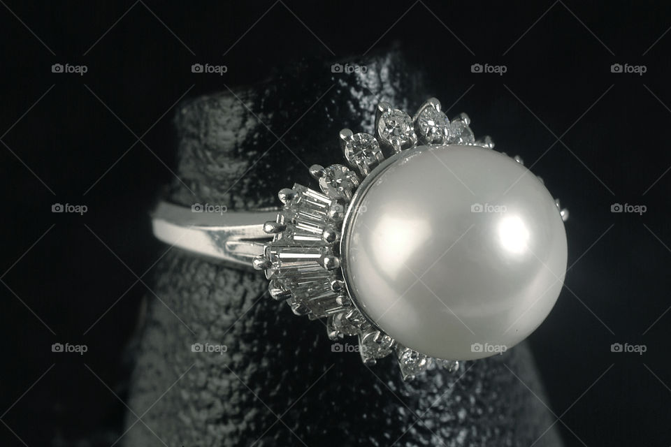 Women with pearl ring