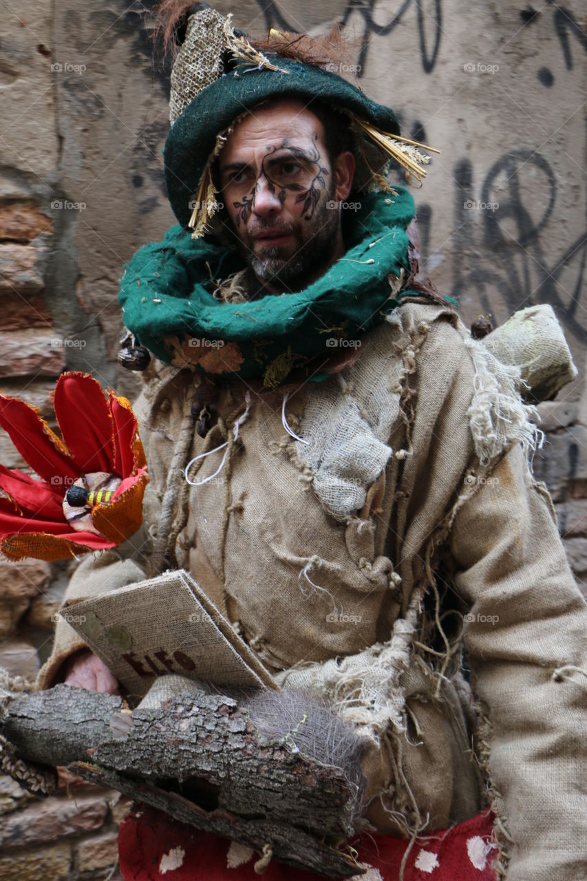 Man in jute costume outdoors