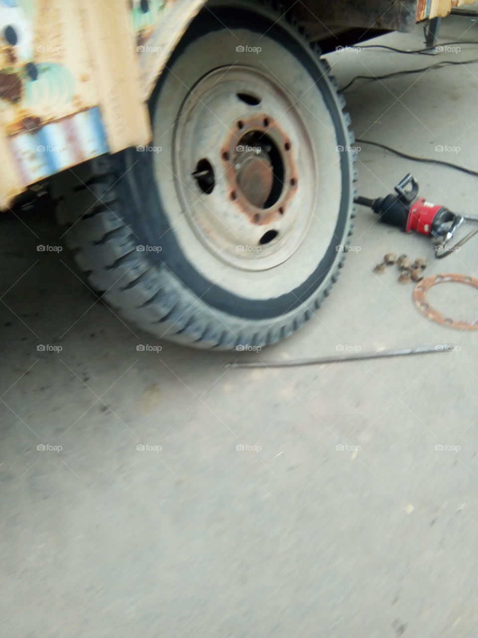 Repairing of a tyre of a vehicle.