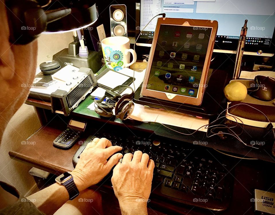 Working from a desk in a home office.