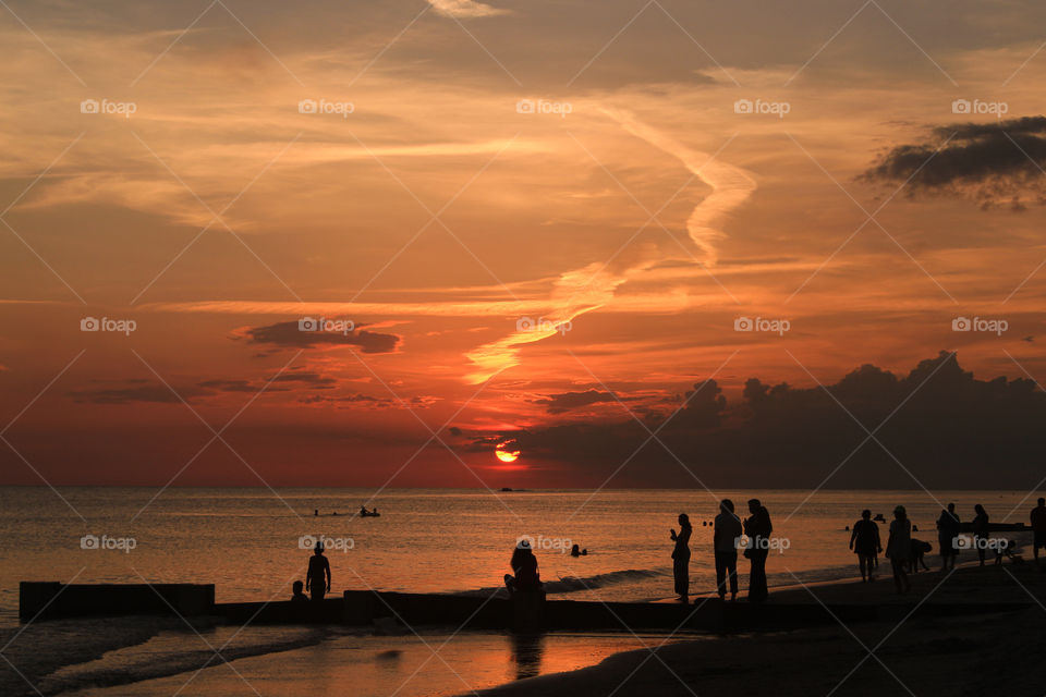 I love to watch sunset on the beach