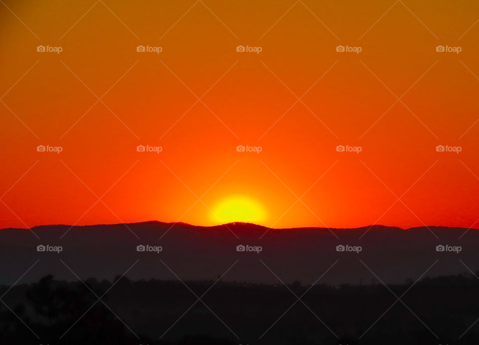 Sunset over a mountain range.