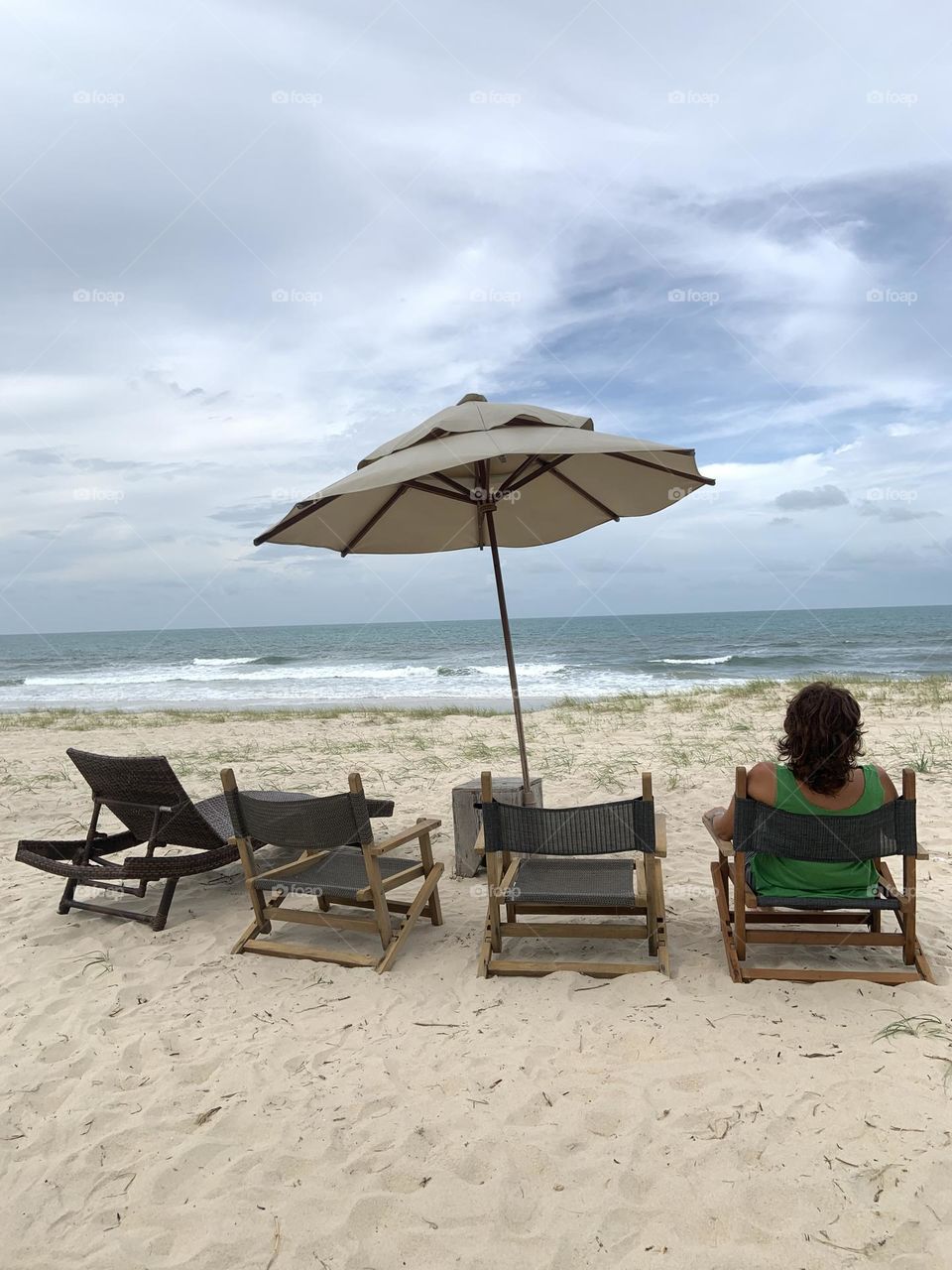 Woman alone looking sea