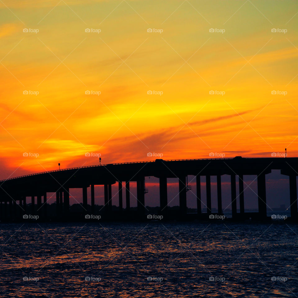 Spectacular sunset sweeping over the bridge that crosses the entrance to the Gulf of Mexico!