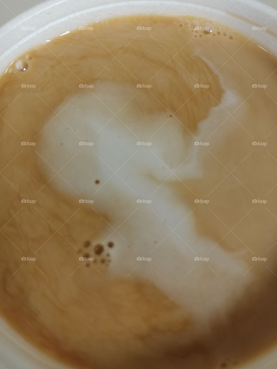 the swirl in this cup of coffee from yesterday morning was absolutly astounding and it looked like the surface of another planet.