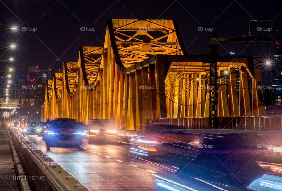 Chasing headlights on a bridge over the Han River is Seoul, South Korea