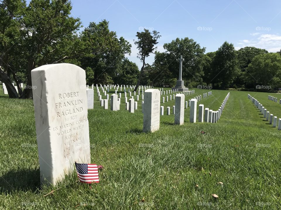 Soldier’s headstone and other graves at Arlington National Cemetery. 