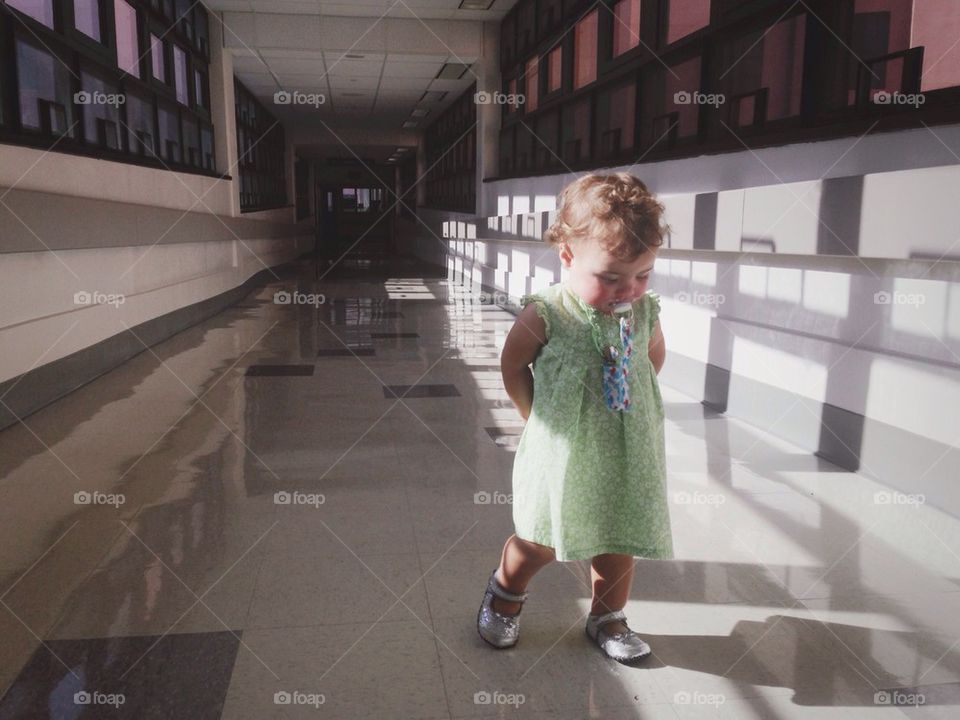Toddler in a Long Hallway