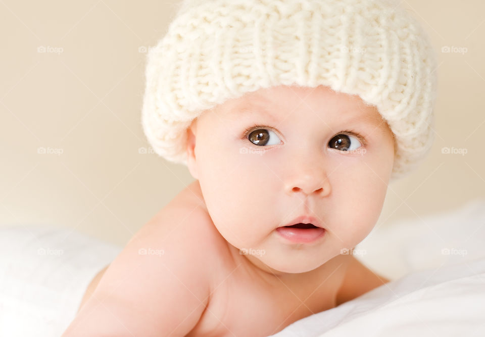 Cute baby lying on bed