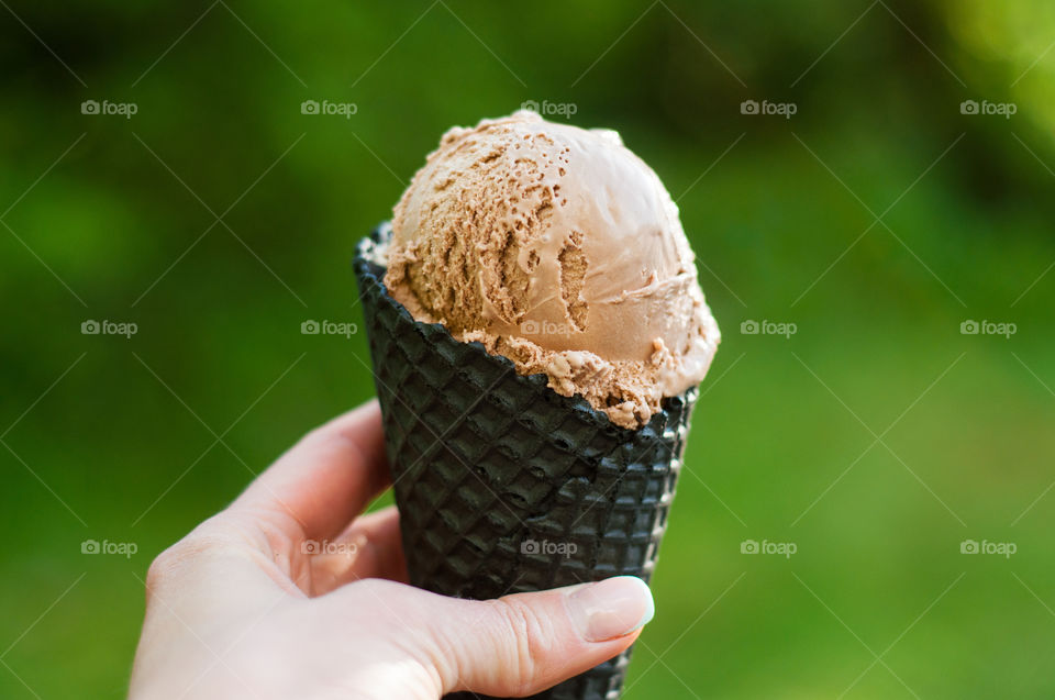 Woman holding chocolate ice cream