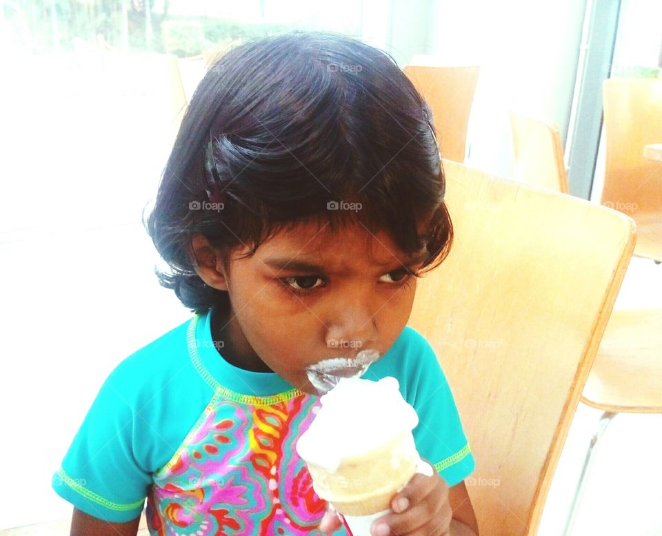 Little girl enjoys ice cream
