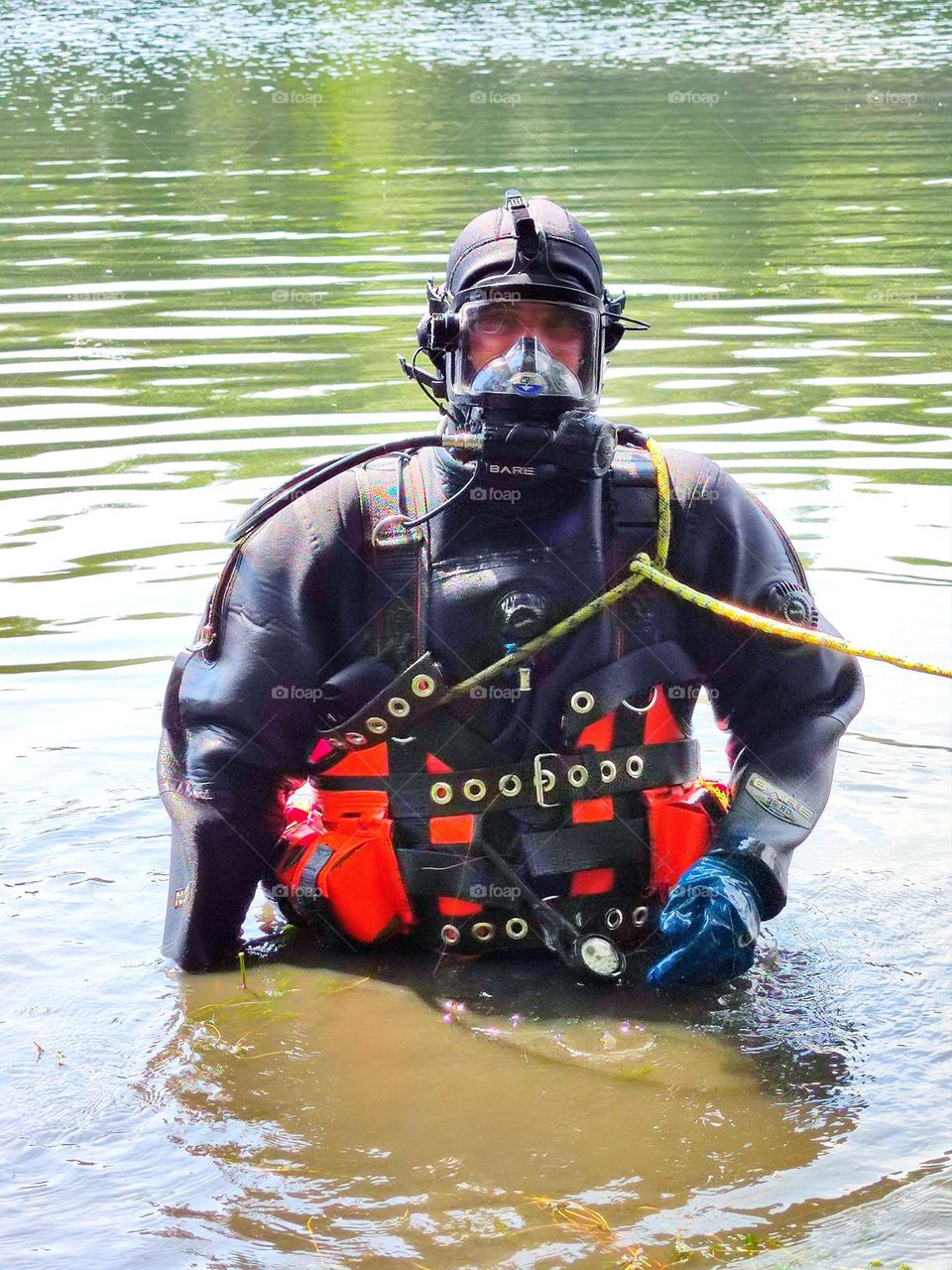 Scuba diver standing in the river