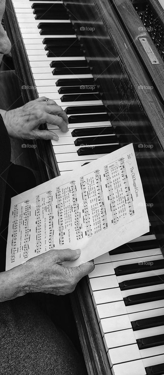 Playing piano - black and white b&w