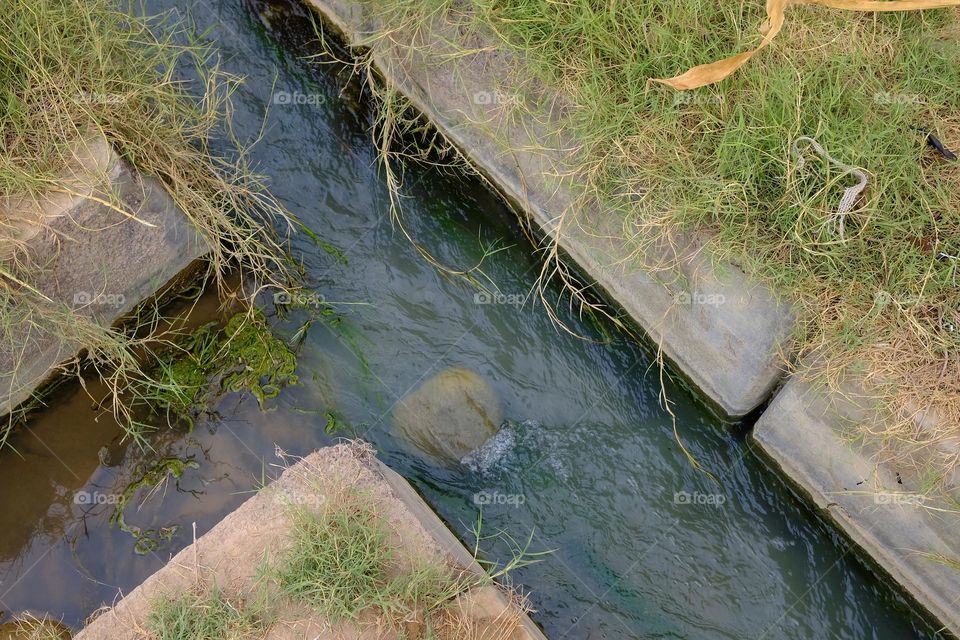 Irrigation canal with water for agriculture