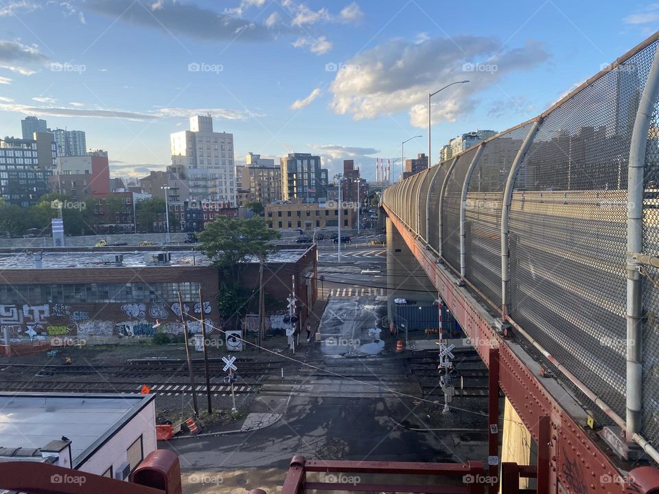 Sunset time has a way of making ordinary things appear more intense when it lends its atmospheric glow. Such is the case here as we are overlooking “Greenpoint”, Bklyn and LIC, Queens from the “Pulaski Bridge”. 2023. Hypnotic Productions