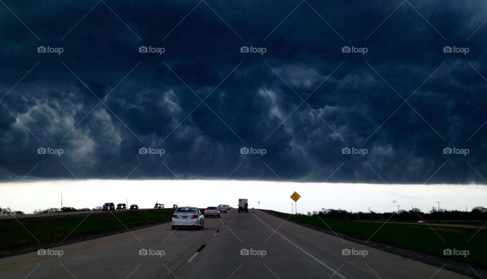 Ominous skies . Driving on a perfectly sunny day when, suddenly, the heavens descended, turning day into night. Only in Texas! 