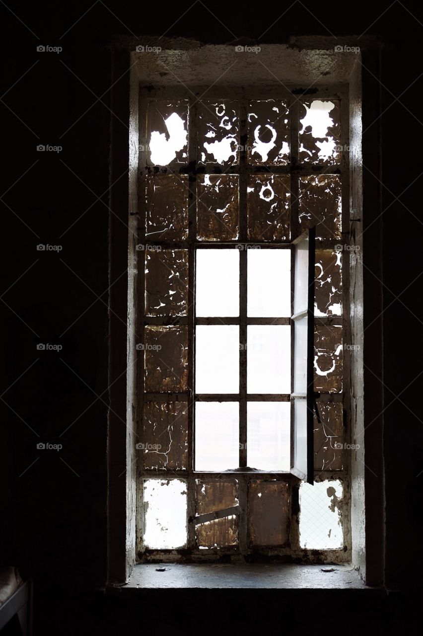 Abandoned Prison Window Backlit By The Sunny Missouri Sky