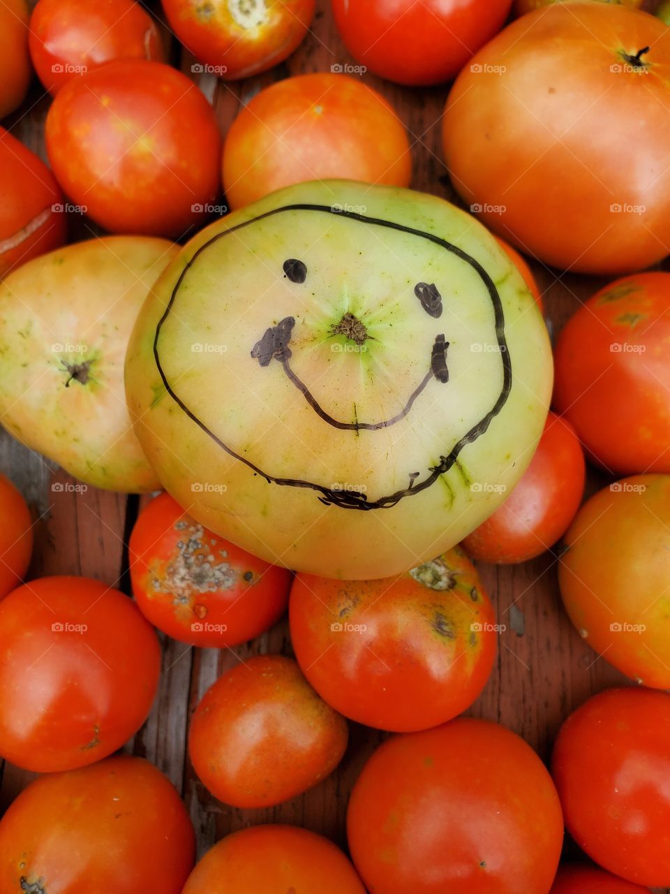 tomato with a smiley face