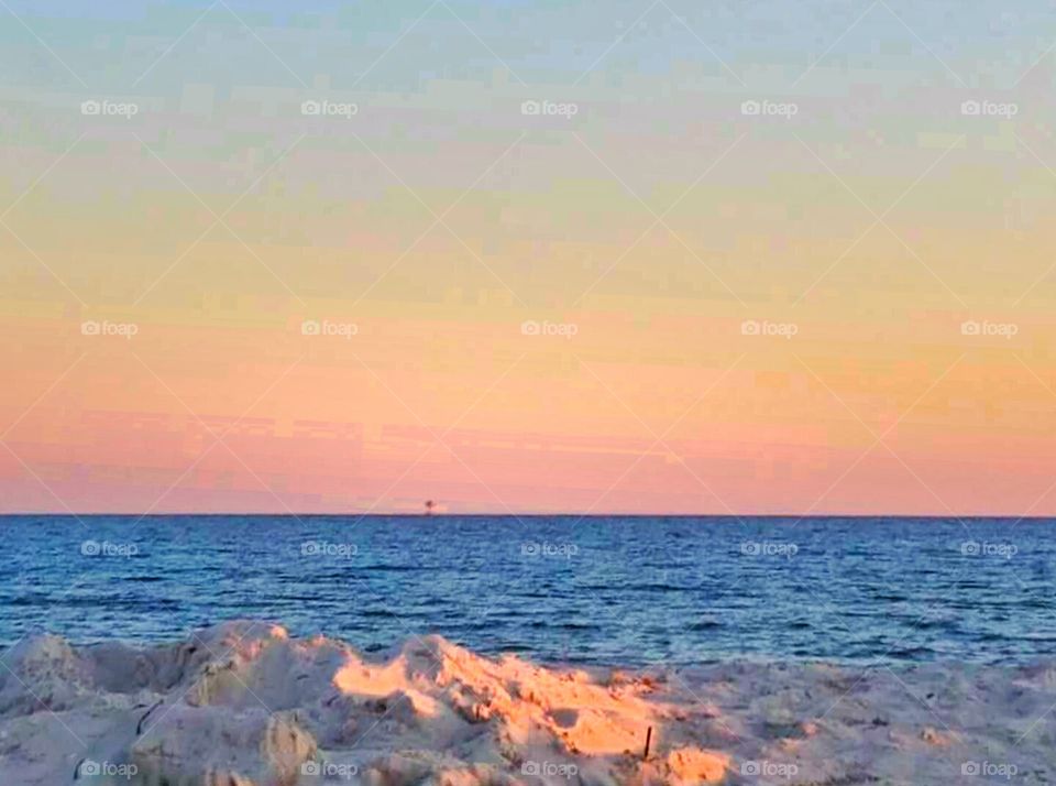 Sunset on sandy beach