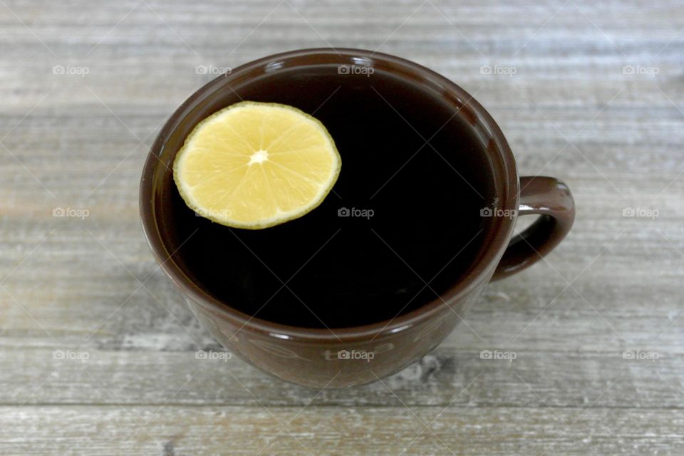 Mug of tea with lemon 