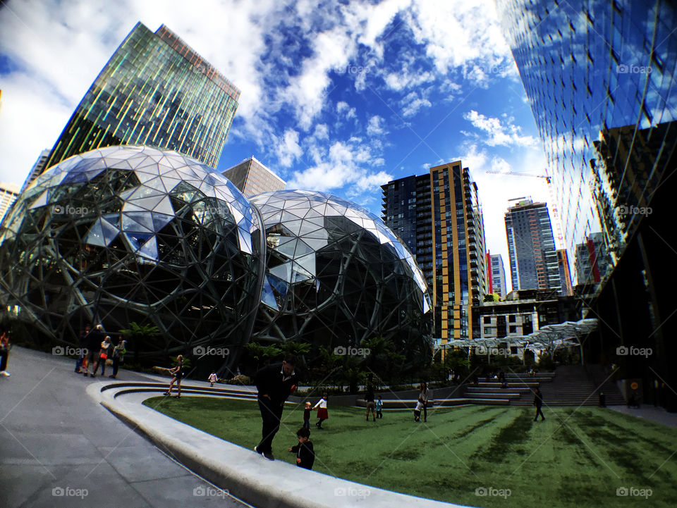 Perfect moment to take a shoot with amazing refection on facade, warm activity that parents took their kids there just for relax. Love.