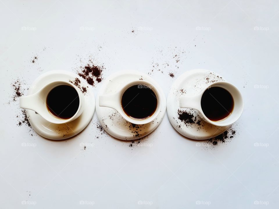 white coffee cups on white background shot from above