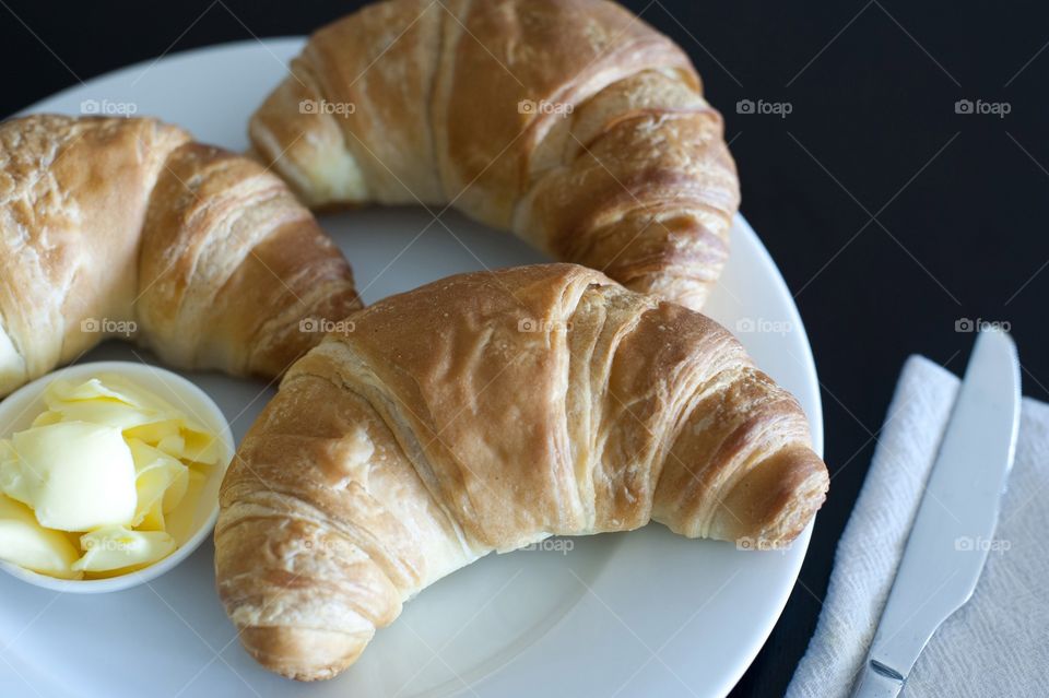 View of croissants with butter