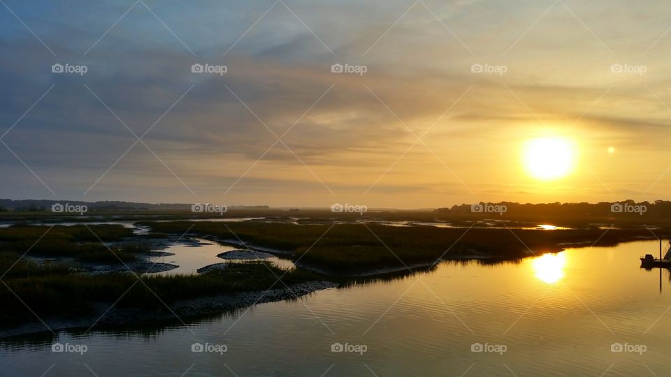 Scenic view of river at sunrise