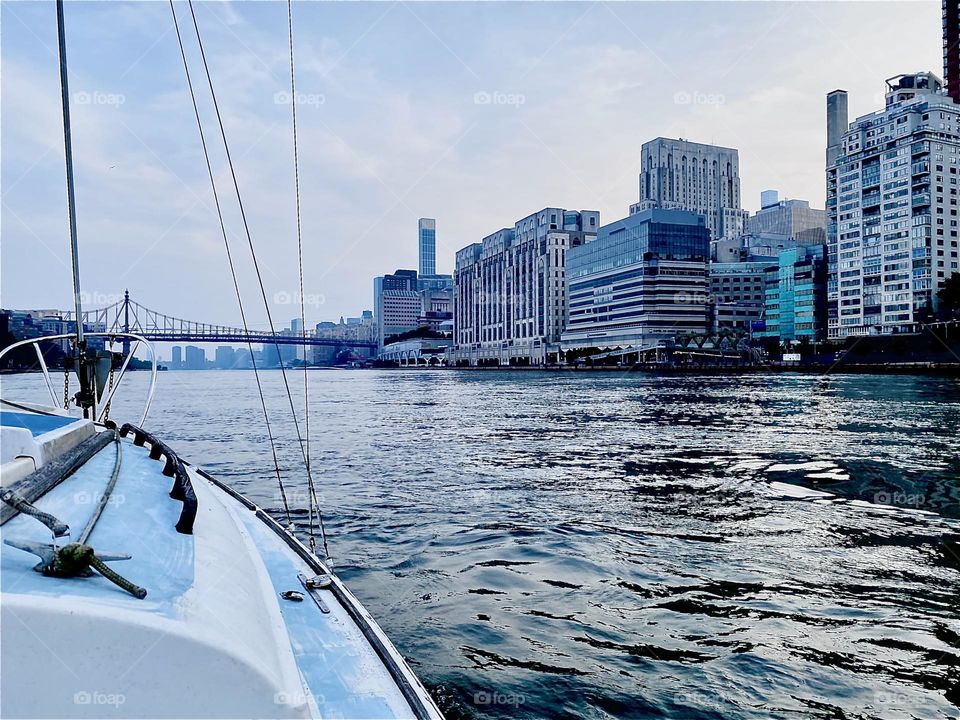 Motoring our new boat, a “23 O’Fay” home to “Newtown Creek” from “Mamaroneck” we passed by many beautiful sites such as this one here on the “Upper East Side” of “Manhattan”. 2023. Hypnotic Productions