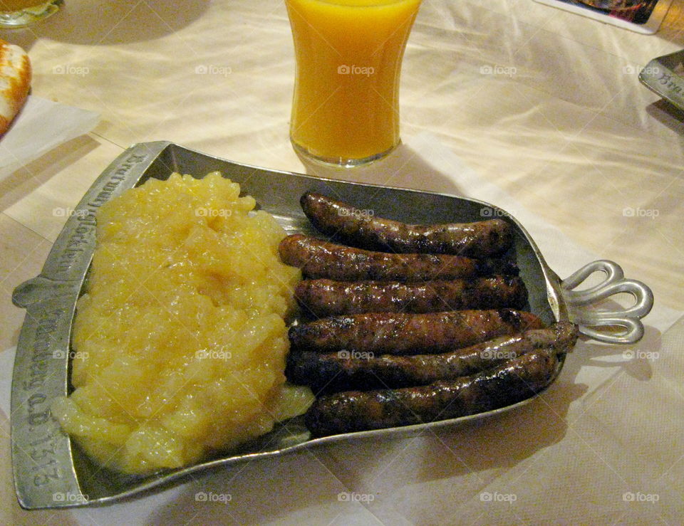 Food on a plate. fried sausages with mashed potatoes, salad