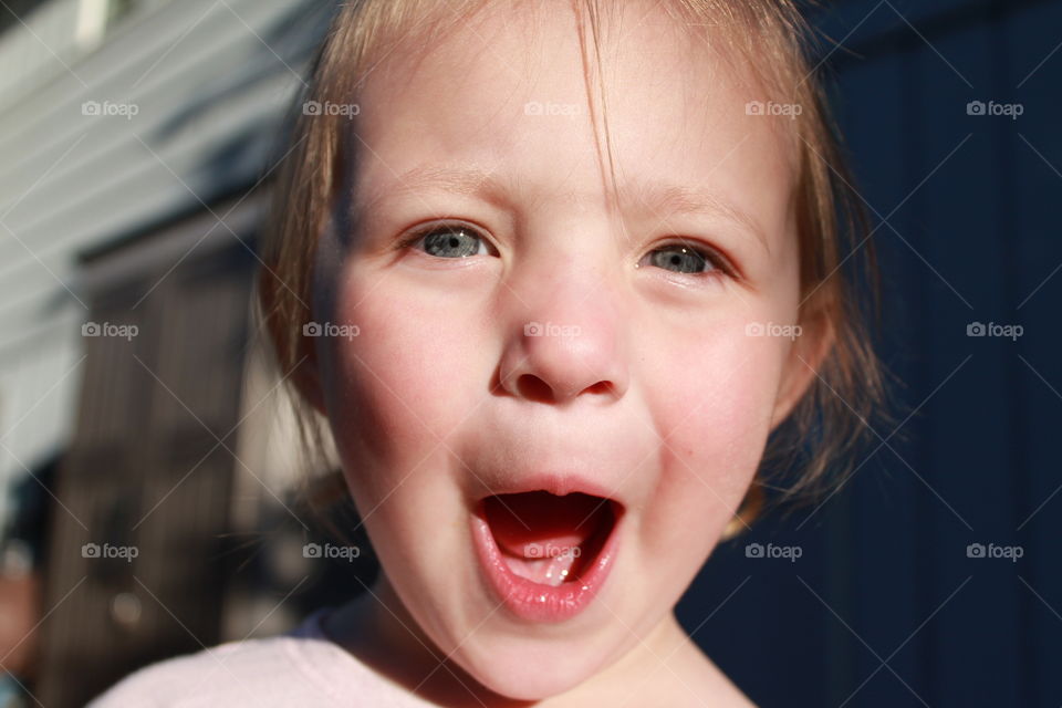 Close-up of a girl making funny face