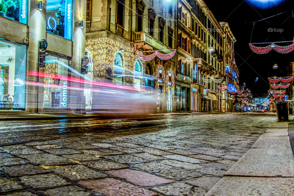 Cars moving in the streets of Milan on Christmas days.