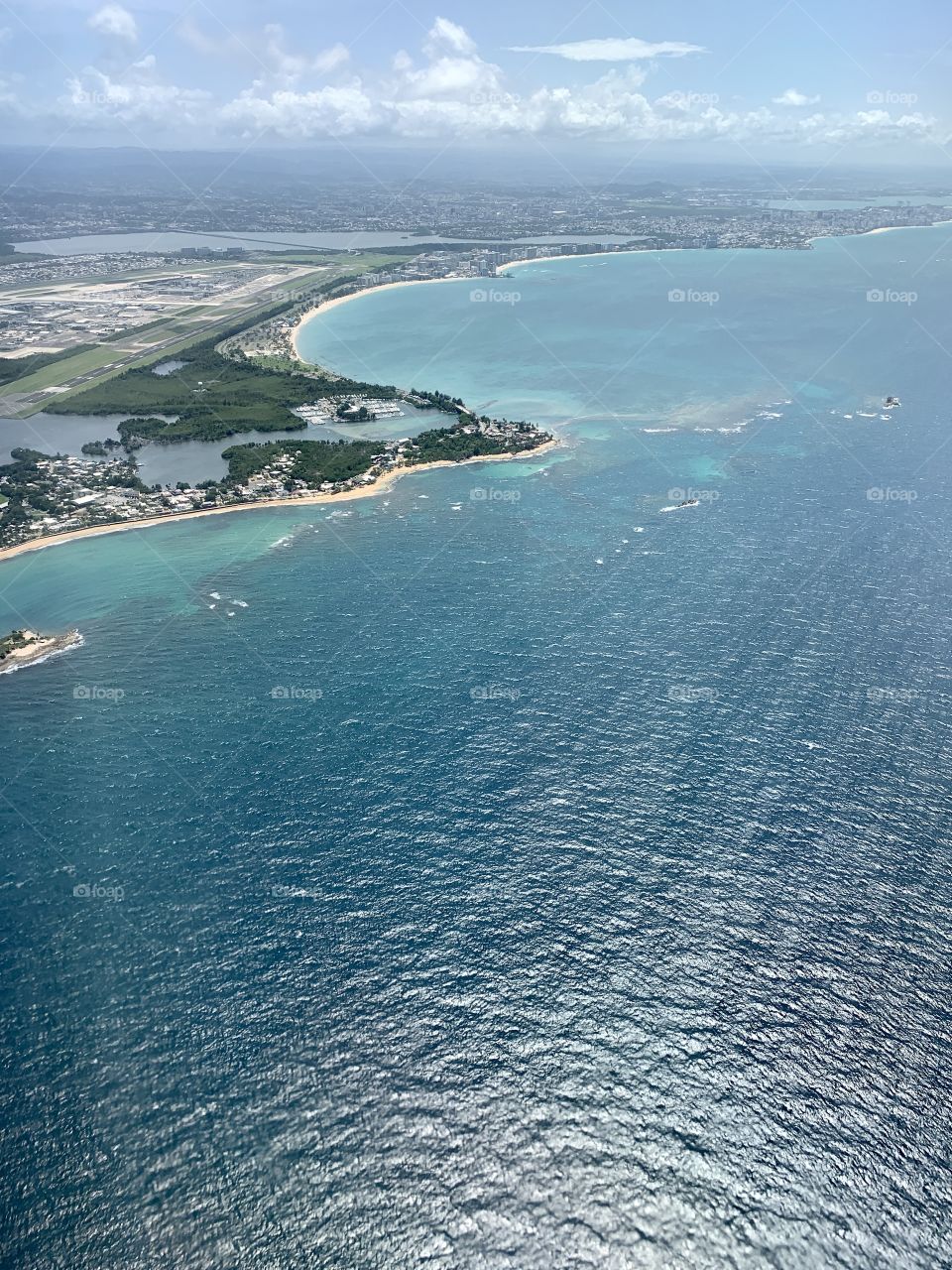 Blue green ocean, isla verde San juan Puerto rico view, blue sky, weather, sunny day, traveling, flying, space. 