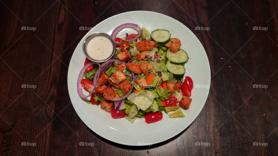 salad with ranch dressing red food overlay