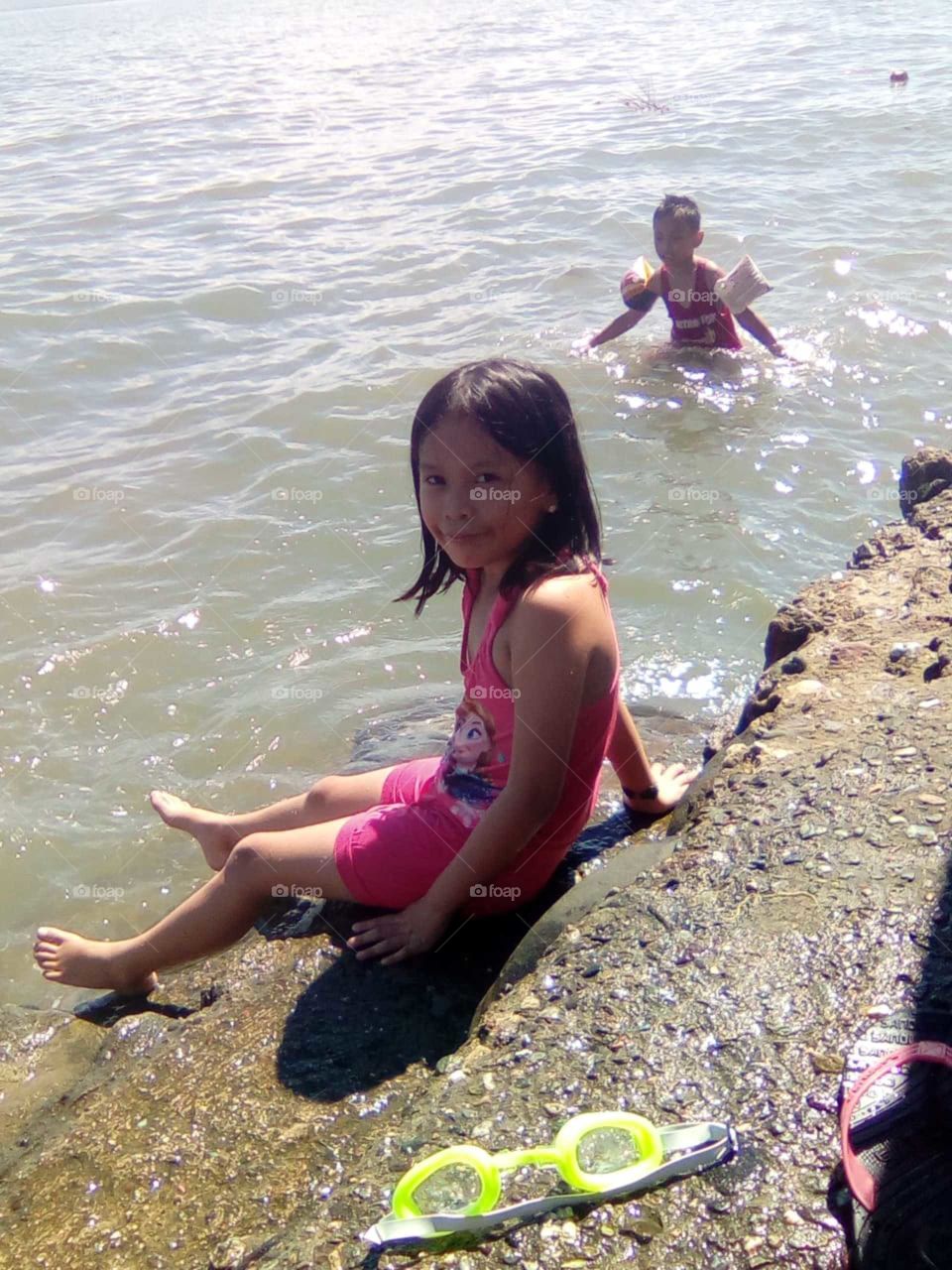 Our second daughter a few years old enjoying the beach a whole lot better than our Mary.