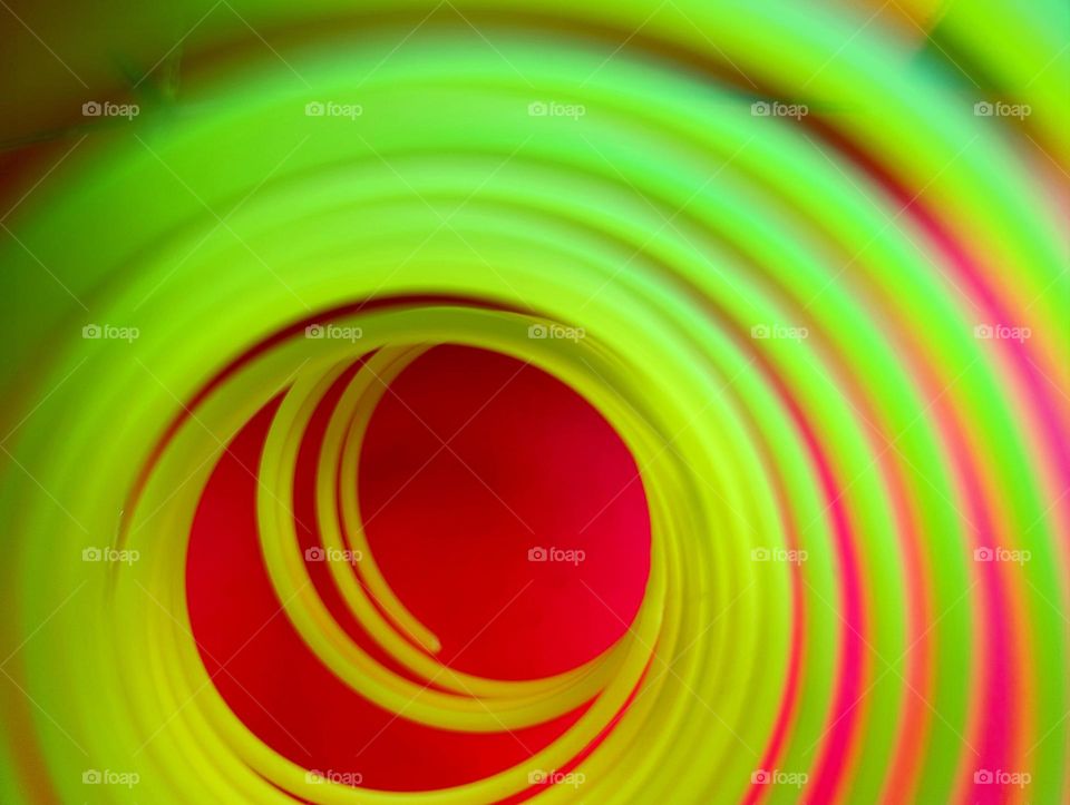 green spiral on red background.