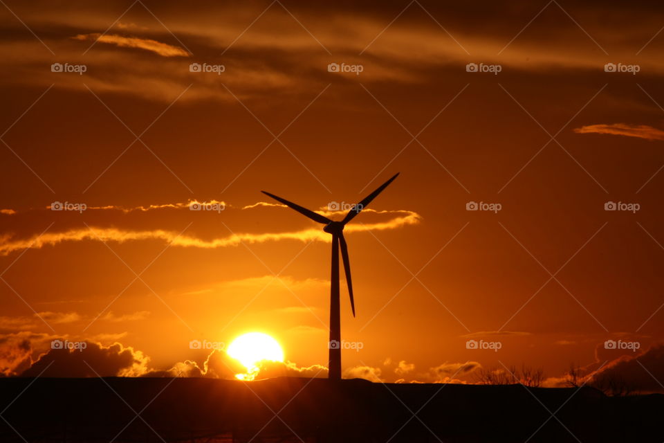 Wind turbine at sunset