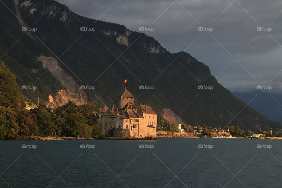 Chillon castle at sunset on the shores of Lake Geneva in Montreux, Switzerland