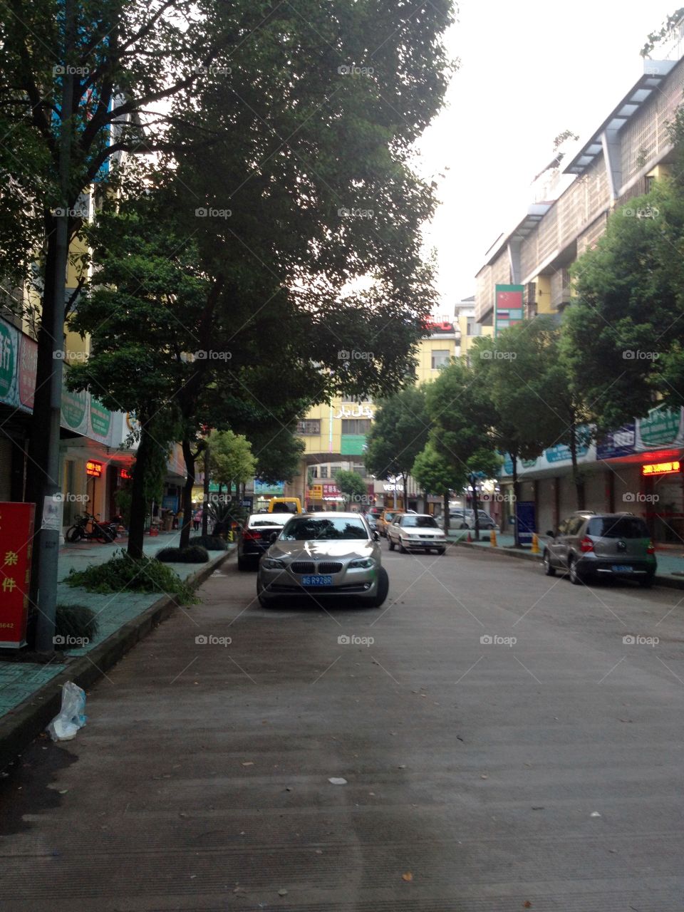 BMW parked near sidewalk on a street in China