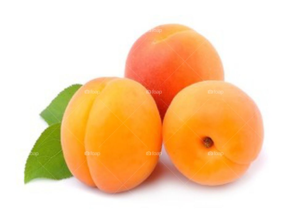 sweet peaches with green leaf