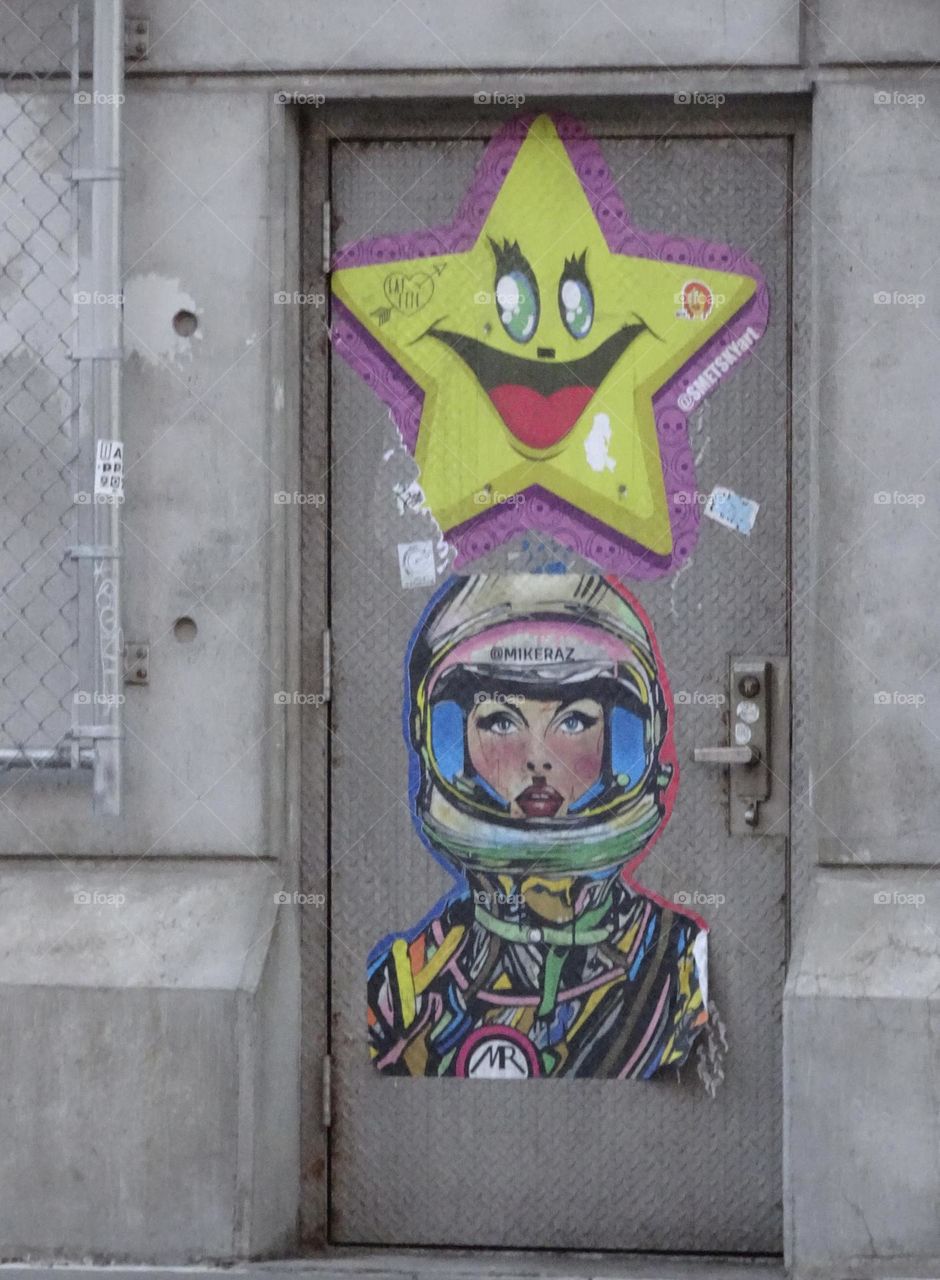 Yellow star and astronaut woman murals