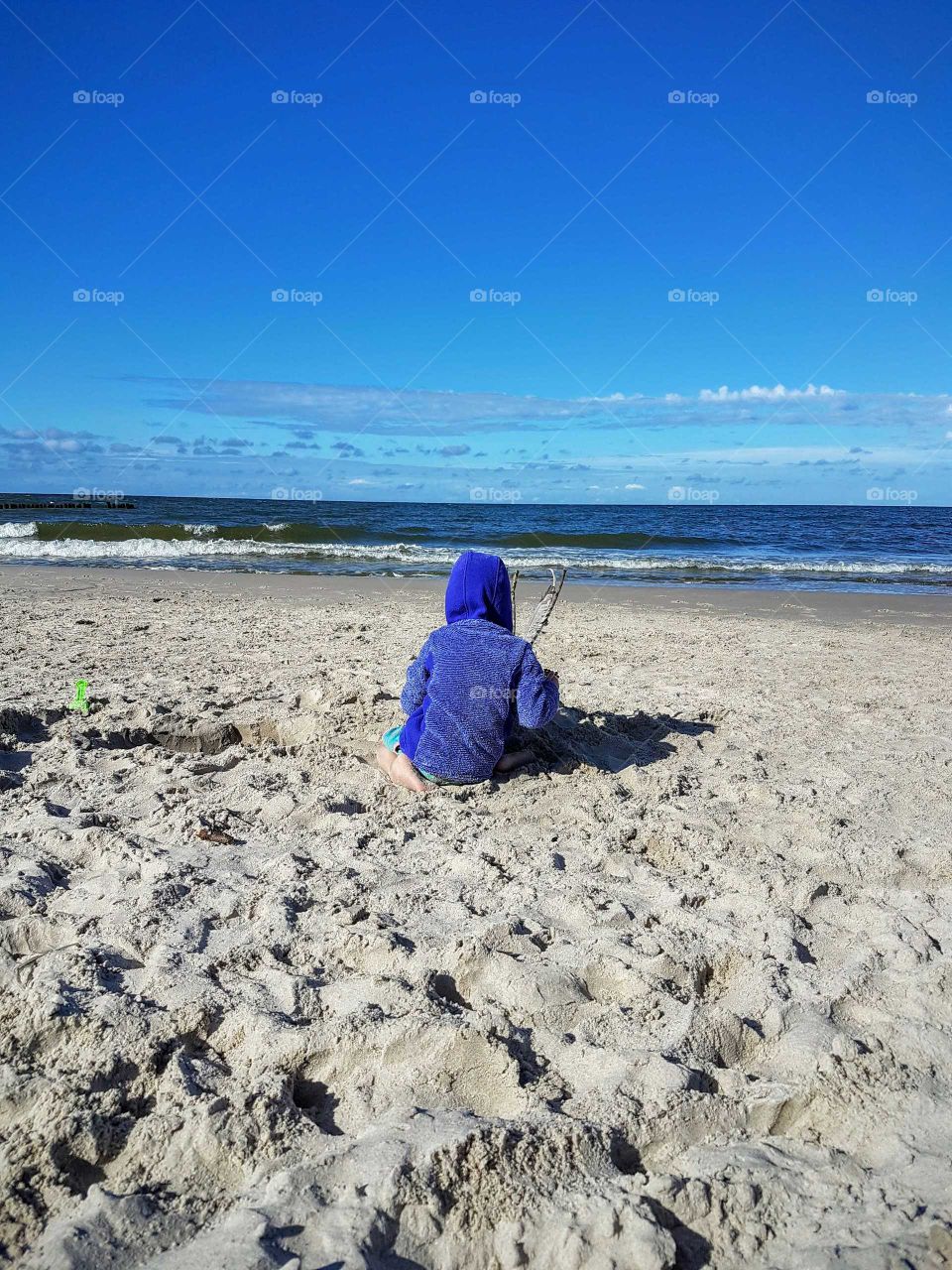 Girl playing on the beach
