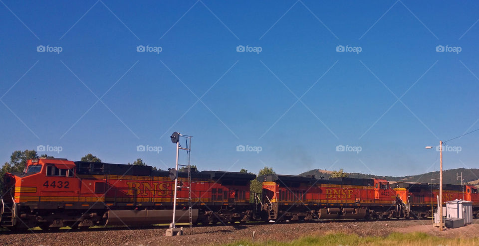 Train Engines Traveling The Tracks