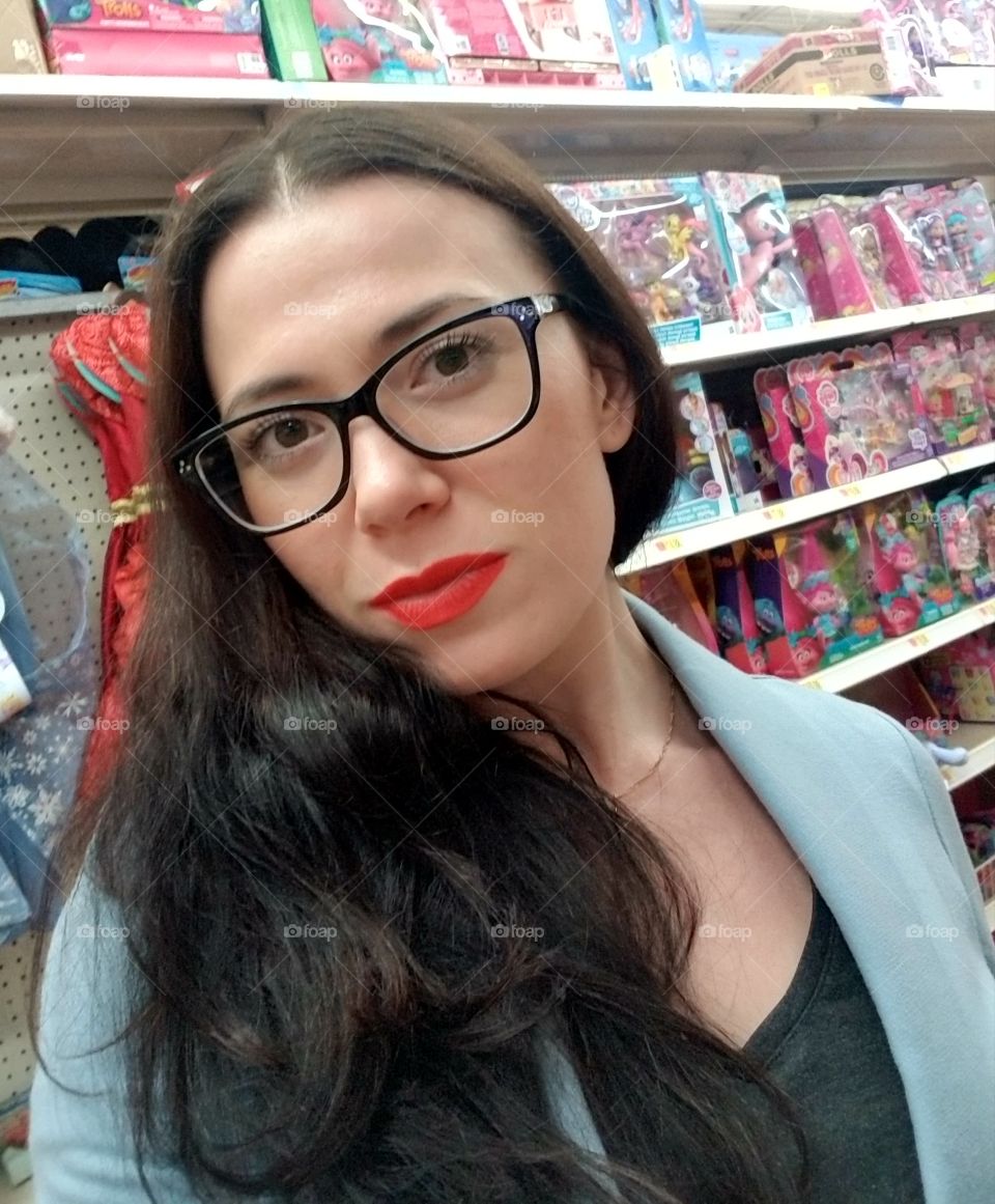 with red lipstick in toy section