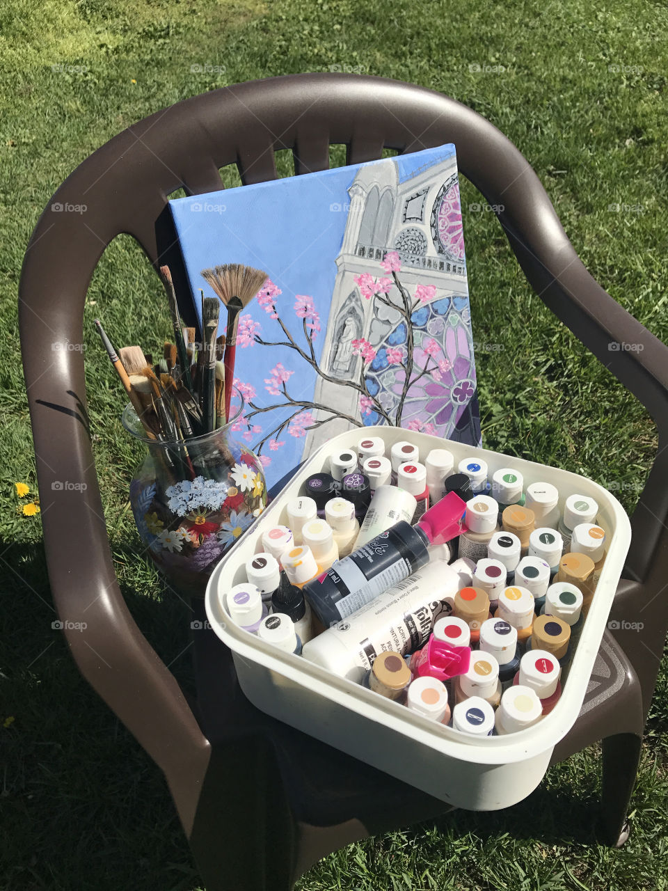 Painting, paints, brushes, and painted vase
